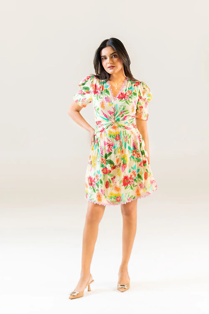 Front view of cream puff sleeve floral short dress with colorful design