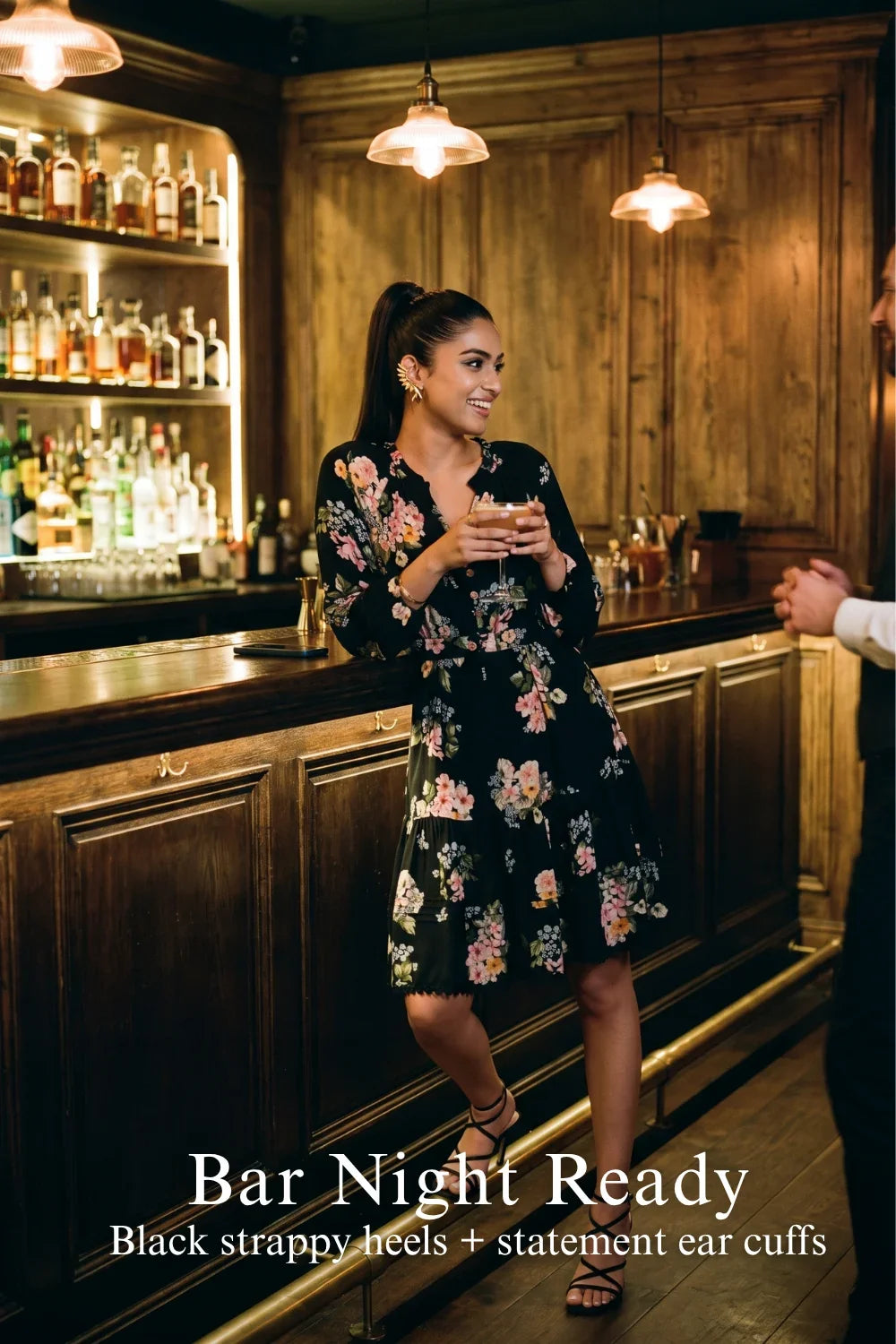 Woman in Pretty Pixie black floral long-sleeve tiered button-down dress styled for a styled look