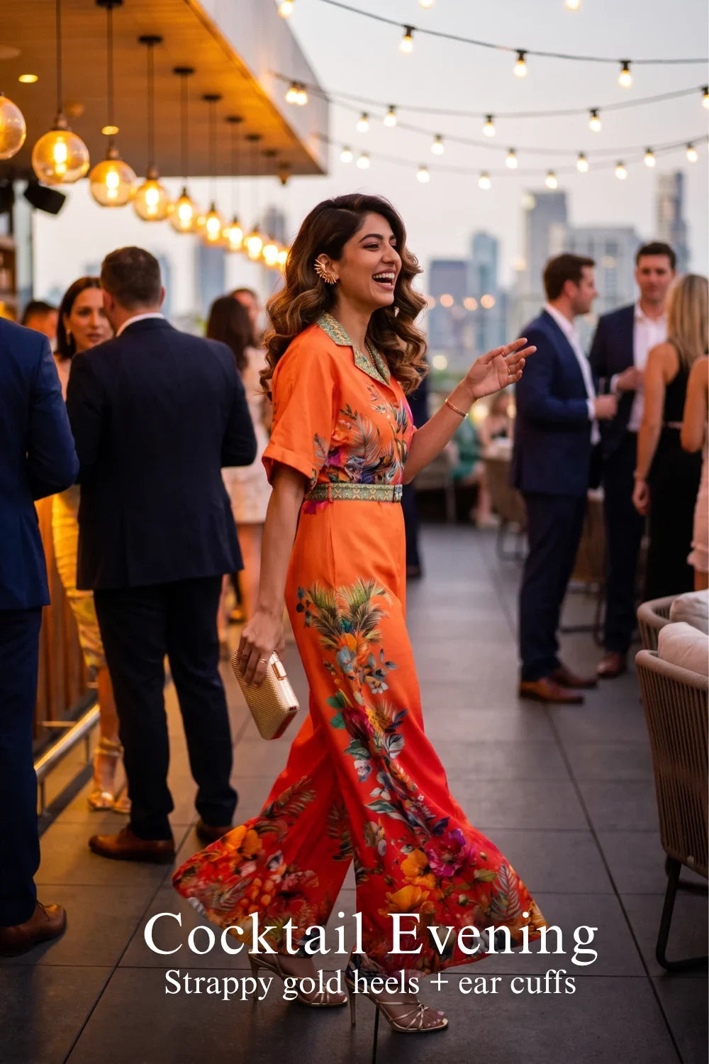 Woman in Pretty Pixie coral orange floral collared belted wide-leg jumpsuit styled for a styled look