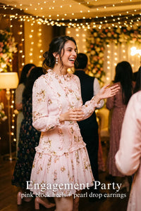 Woman in Pretty Pixie hannah ruffled pink floral belted mini dress styled for a styled look