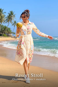 Woman in Pretty Pixie ivory cream floral belted shirt midi dress styled for a styled look
