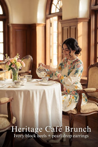 Woman in Pretty Pixie ivory floral ruffle-neck puff-sleeve mini dress styled for a styled look
