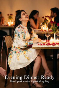 Woman in Pretty Pixie ivory floral ruffle-neck puff-sleeve mini dress styled for a styled look