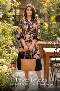 Woman in Pretty Pixie rosalia bloom black floral belted midi dress styled for a styled look