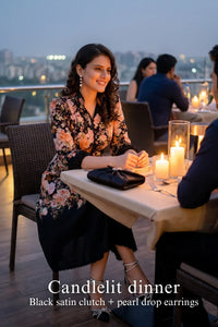 Woman in Pretty Pixie rosalia bloom black floral belted midi dress styled for a styled look