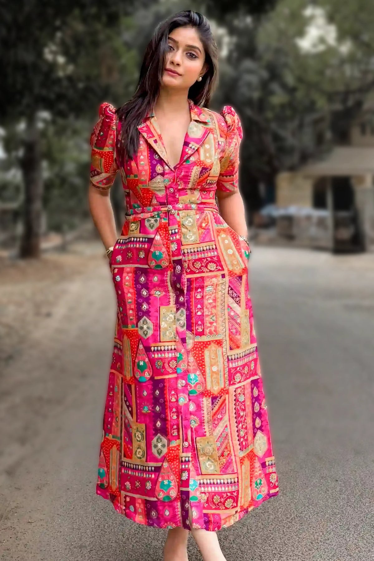 Akshata Deshpande wearing the Royal Magenta silk floral belted midi dress by Pretty Pixie, styled outdoors.