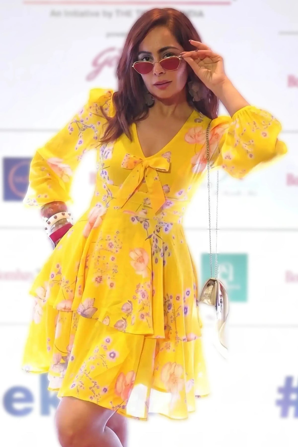 Ashima Kumar in PrettyPixie Marigold yellow ruffle tie-neck mini dress