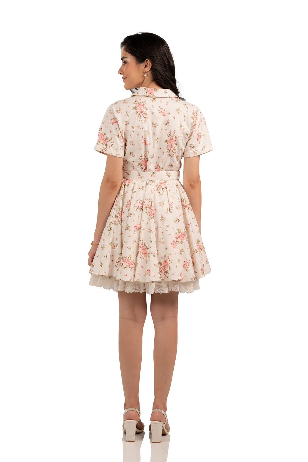 Back view of vintage floral shirt dress with short sleeves, belted waist, and lace-trimmed hemline.