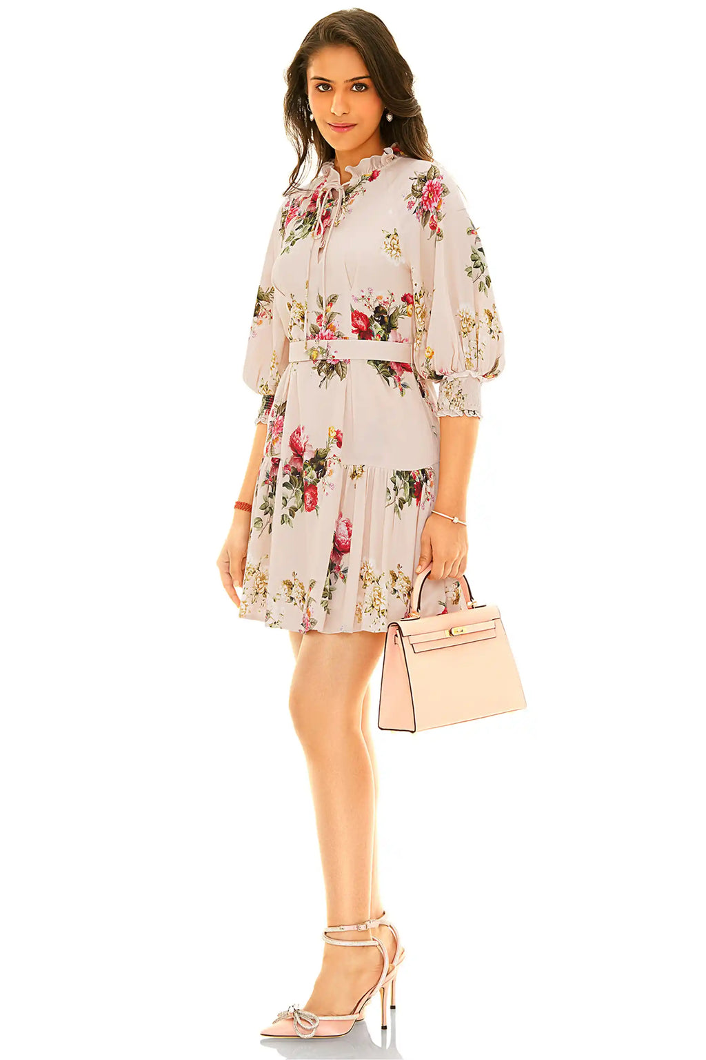 Side view of beige floral mini dress with puff sleeves and waist belt