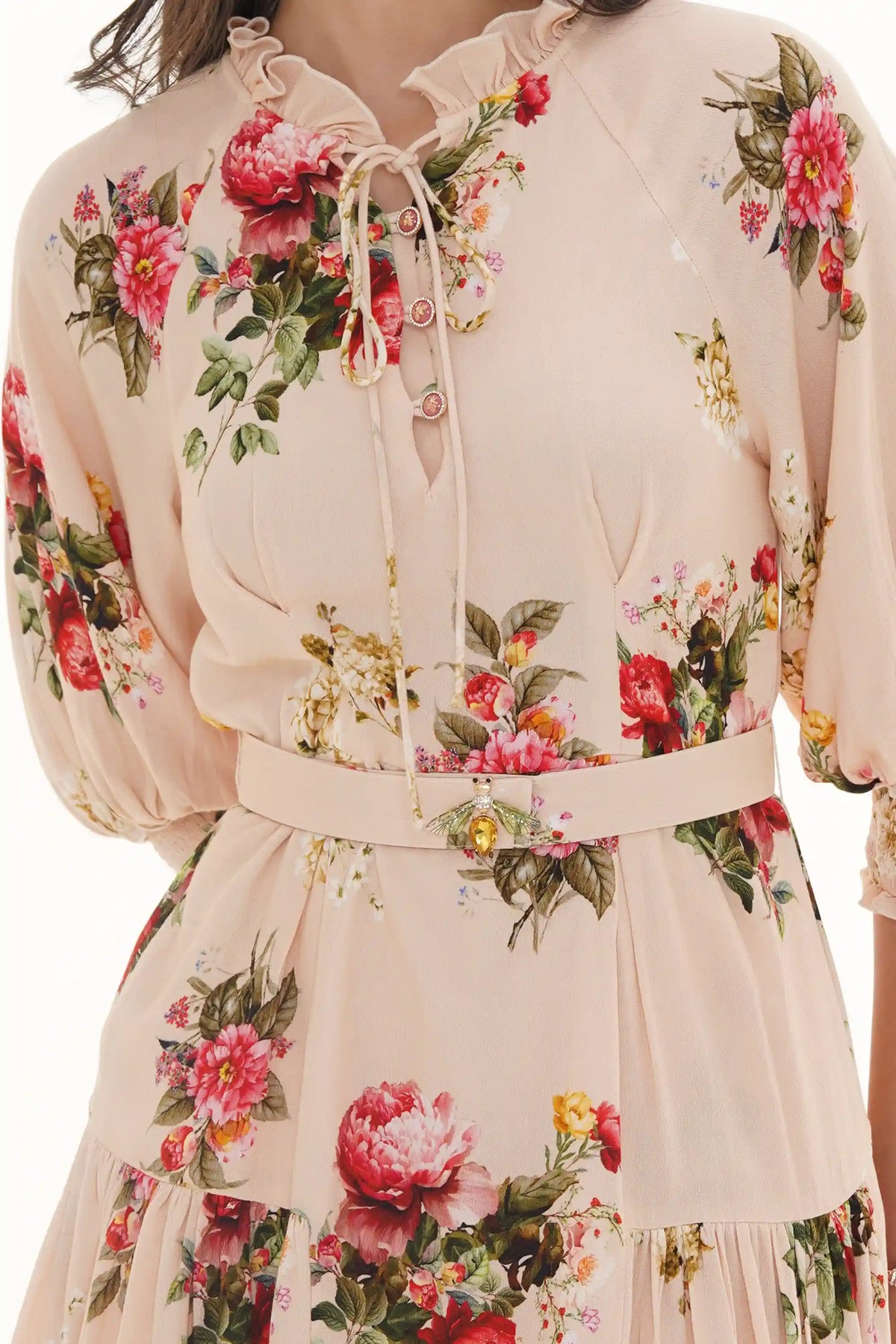 Close-up of Pretty Pixie beige garden rose puff-sleeve belted mini dress