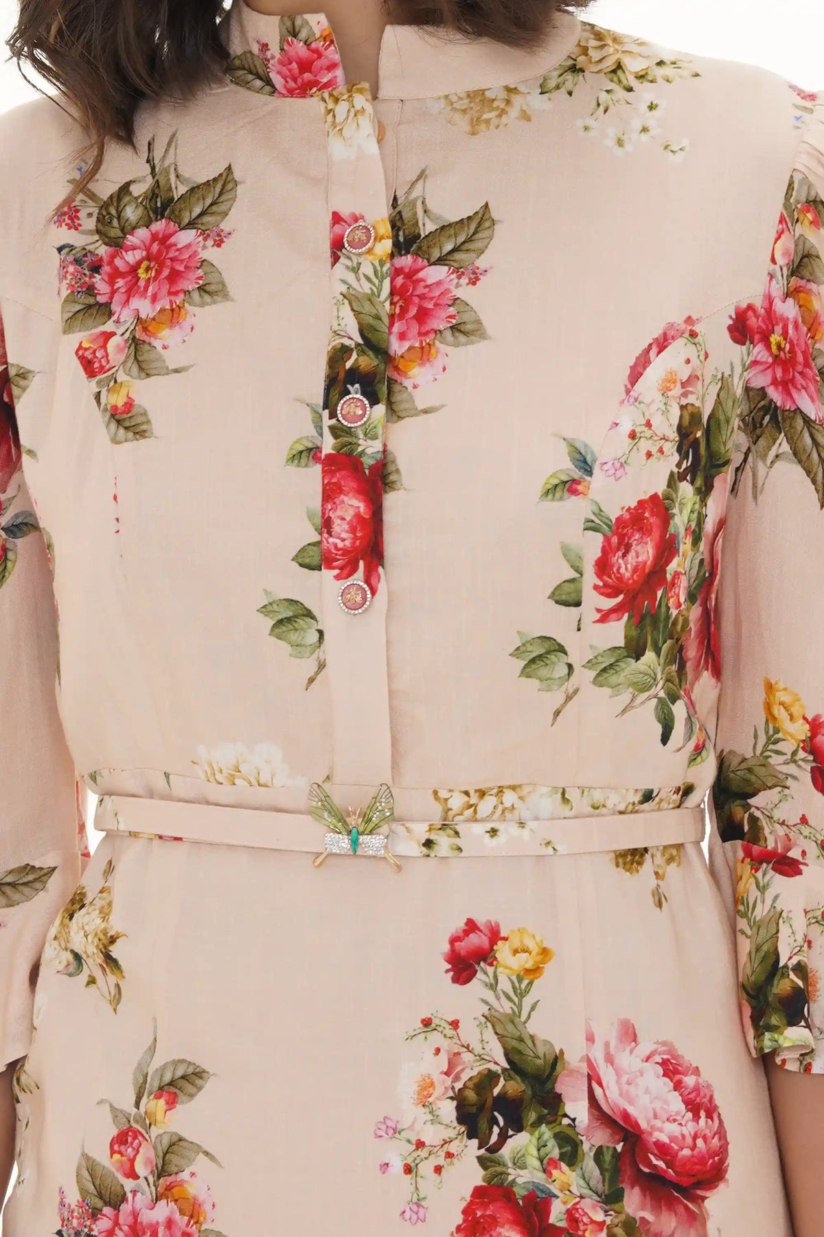 Close-up of Pretty Pixie beige garden rose puff-sleeve belted mini dress, fabric detail