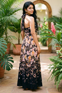 Back view of black floral halter maxi dress with open back; organic cotton women's evening occasion and party wear for women