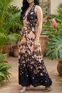 Side profile of black floral halter maxi dress showing fit and flattering silhouette; organic cotton women's occasion wear