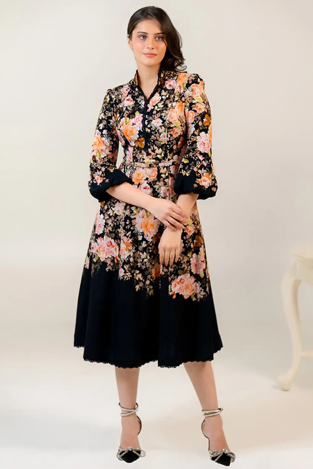 Elegant black floral midi dress front view with long sleeves