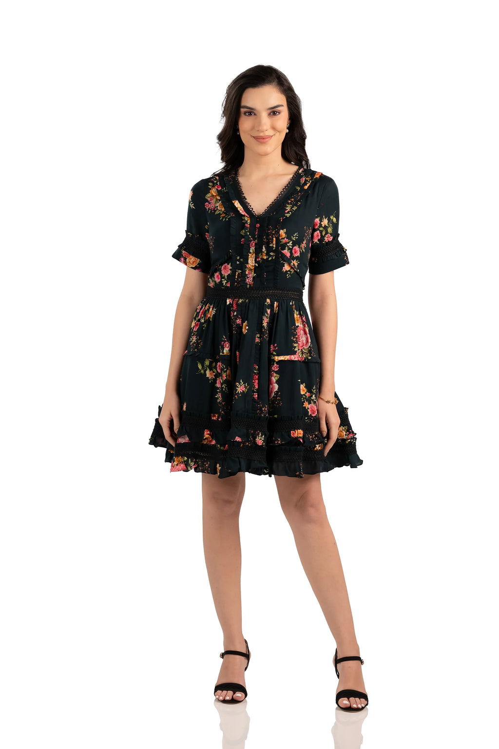 Front view of short black floral dress with ruffle trim, smocked waist, and V-neckline, ideal for casual chic looks.