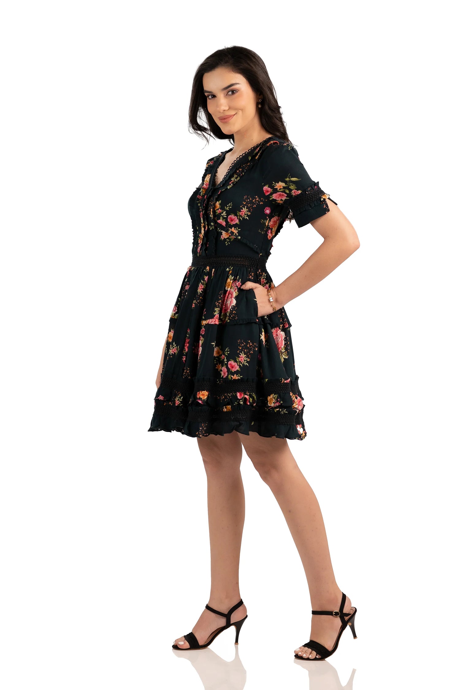 Elegant black floral short dress with layered ruffle skirt, short sleeves, and fitted waist