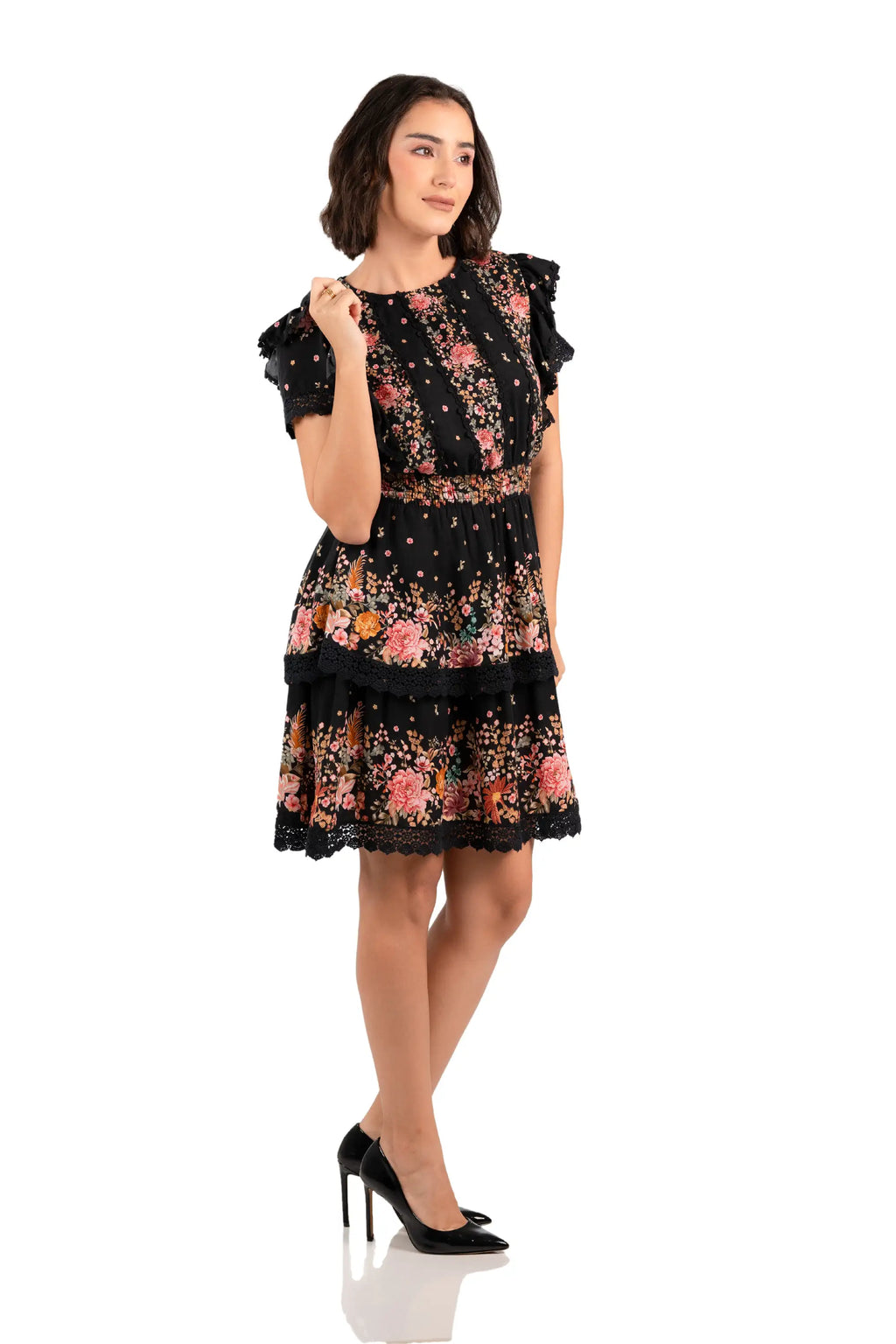 Black floral ruffle mini dress with lace trim and smocked waist, front angle view