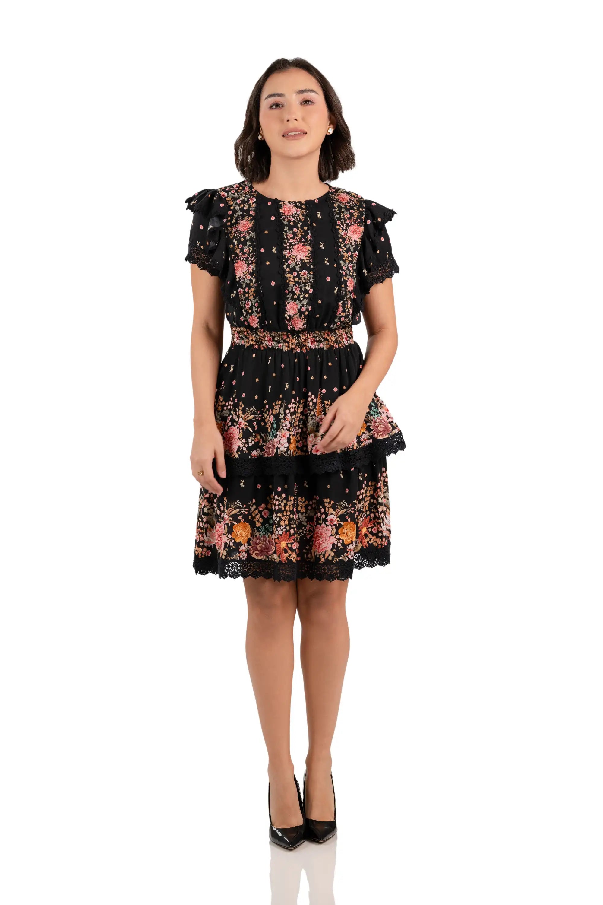 Front view of black floral ruffle mini dress with lace trim and tiered skirt