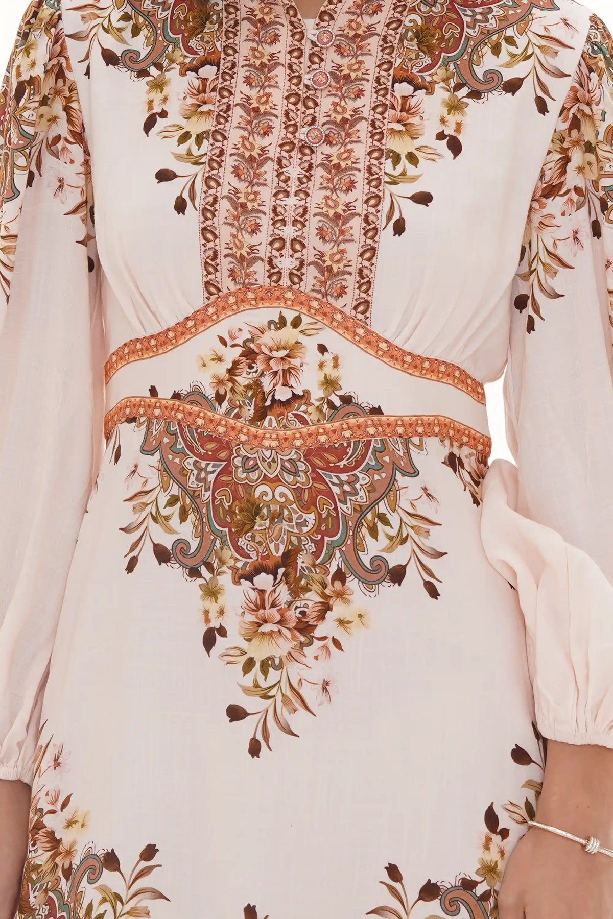 Close-up of Pretty Pixie black floral smocked puff-sleeve mini dress, fabric detail