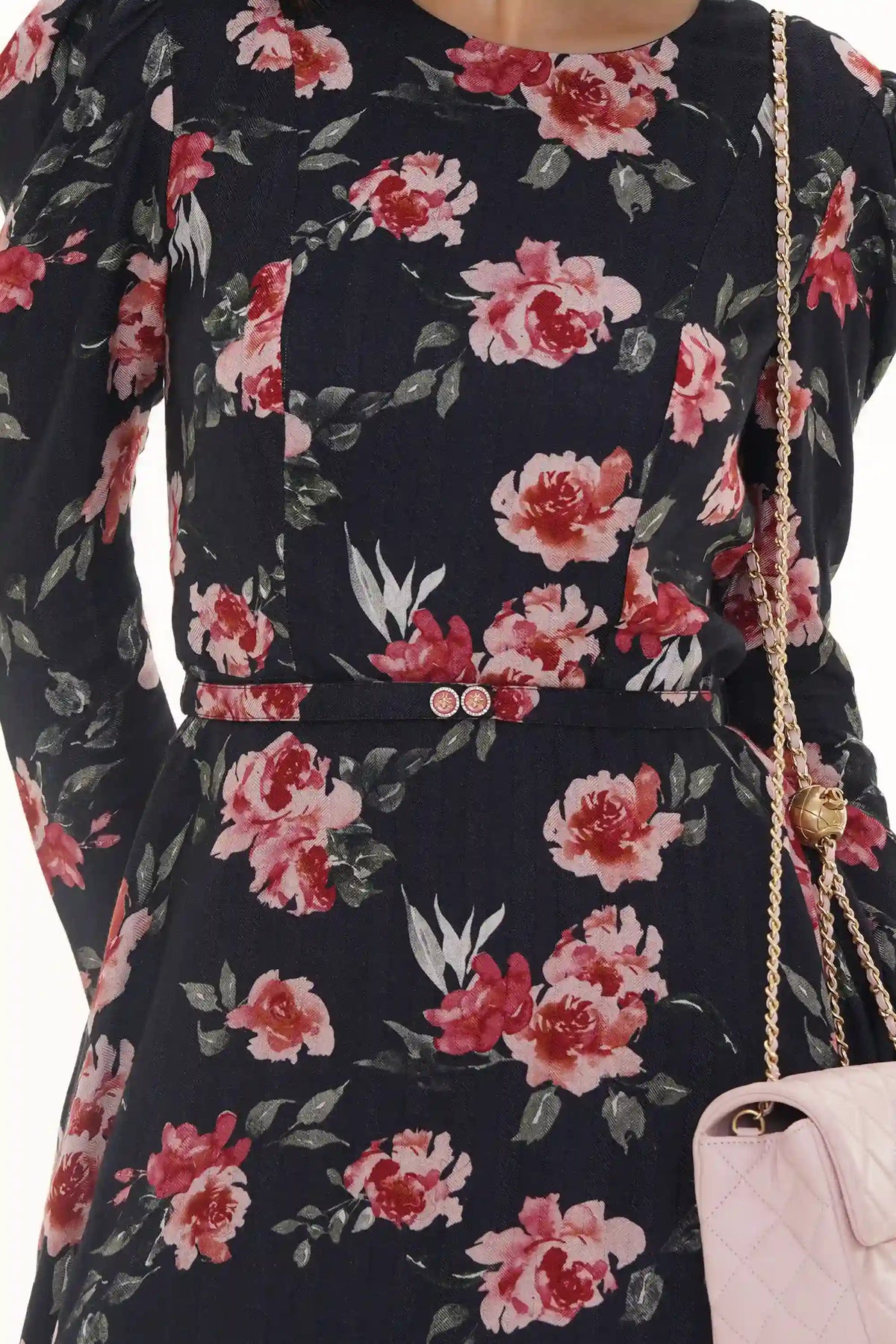 Close-up of Pretty Pixie black floral smocked puff-sleeve mini dress, waist detail