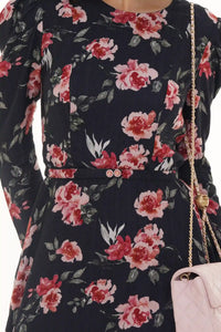 Close-up of Pretty Pixie black floral smocked puff-sleeve mini dress, waist detail