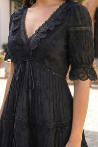 Pretty Pixie black lace pleated tiered mini dress detail view v-neck lace trim ribbon