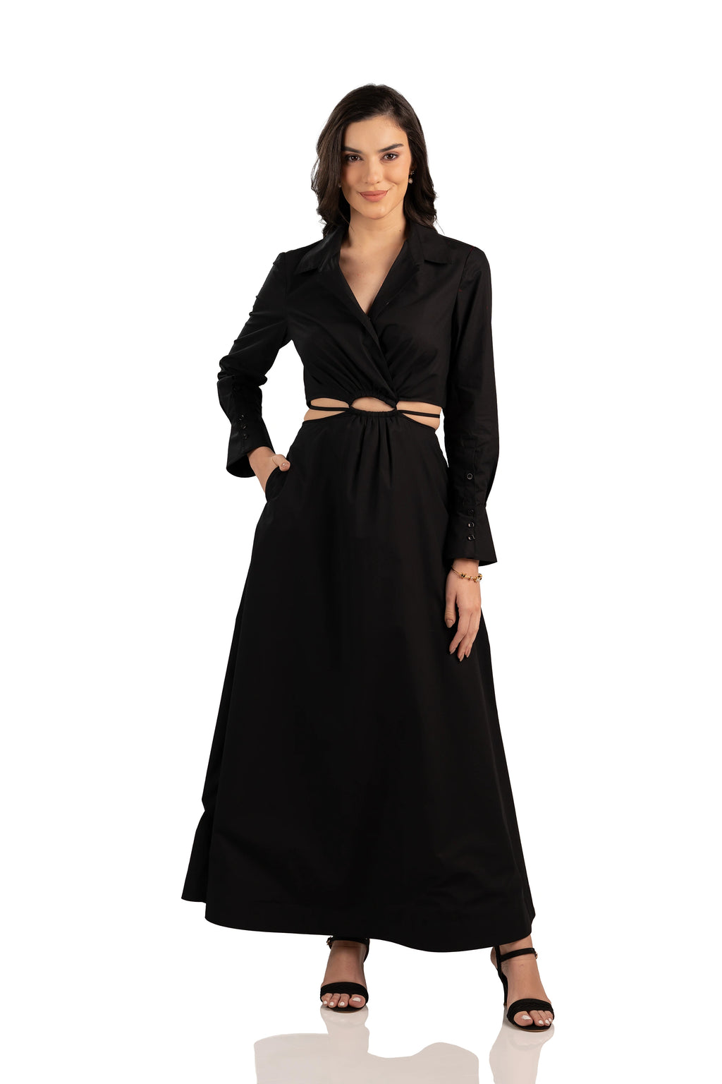 Model wearing black maxi dress featuring front cutout waist, fitted bodice, and A-line skirt.