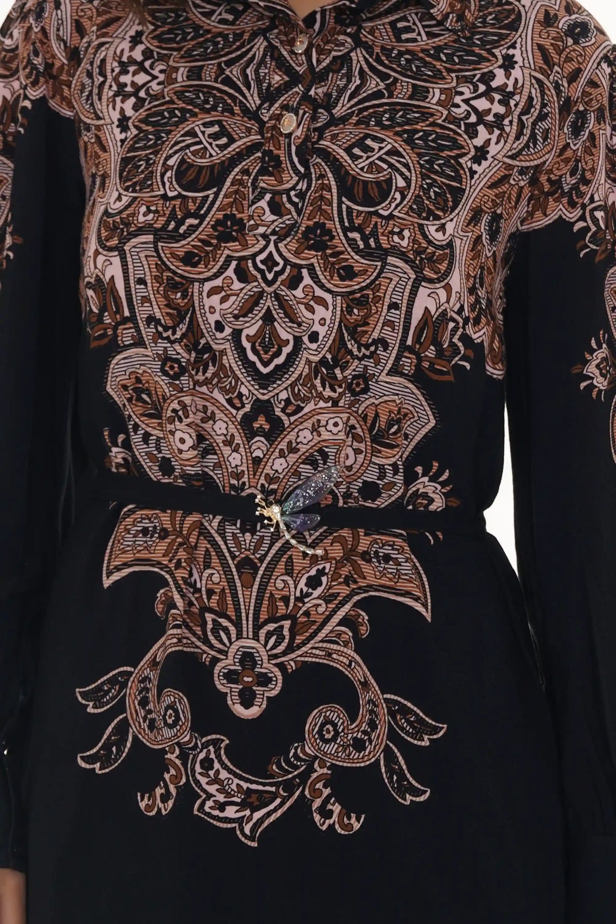 Close-up of Pretty Pixie black paisley belted shirt dress with crystal dragonfly brooch waist detail