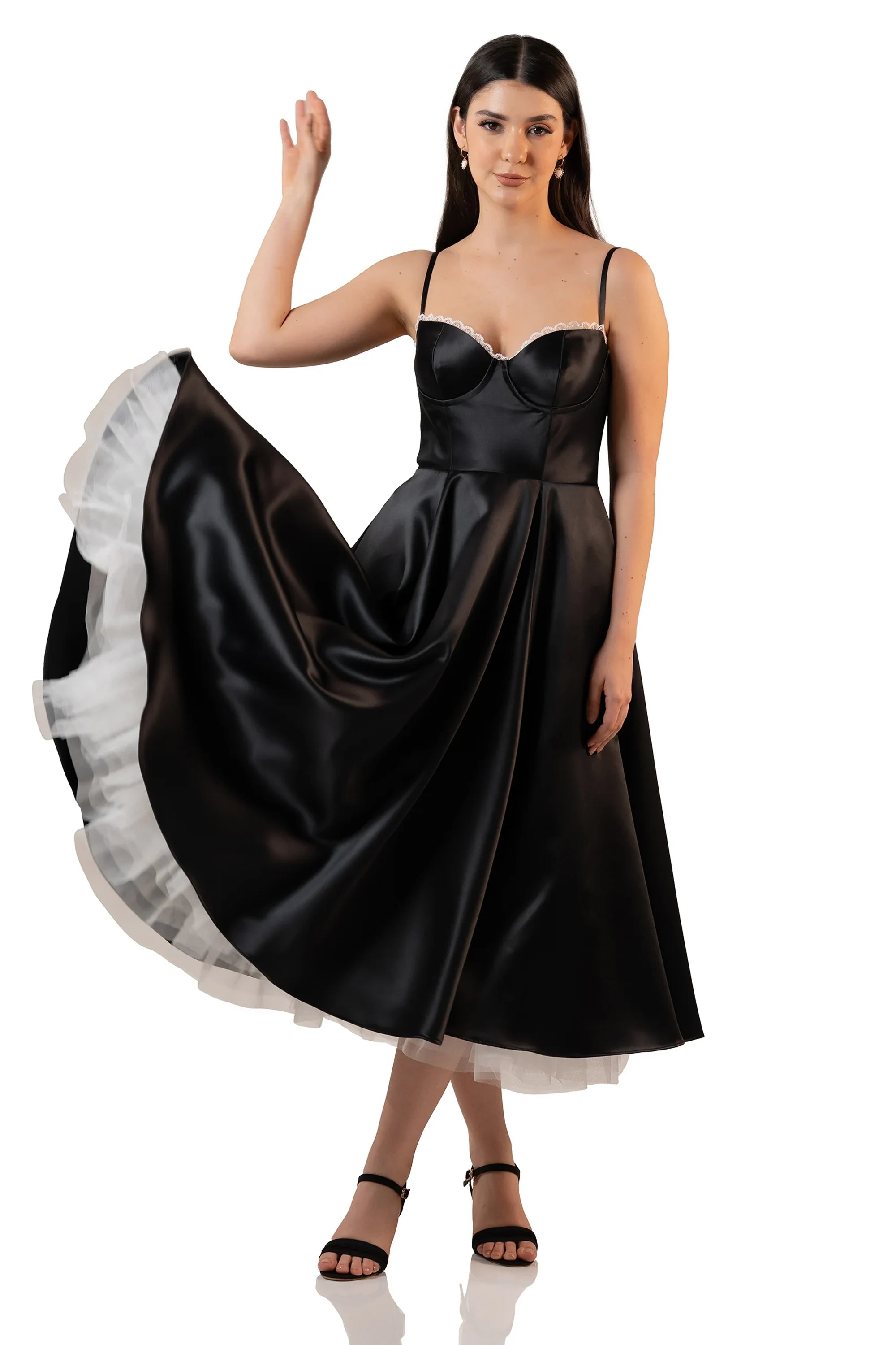 Black satin midi dress with lace neckline and flowing skirt – twirling motion shot