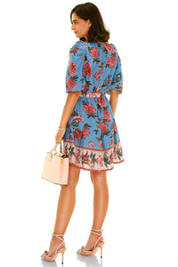 Back view of blue floral mini dress with pink and red flower print