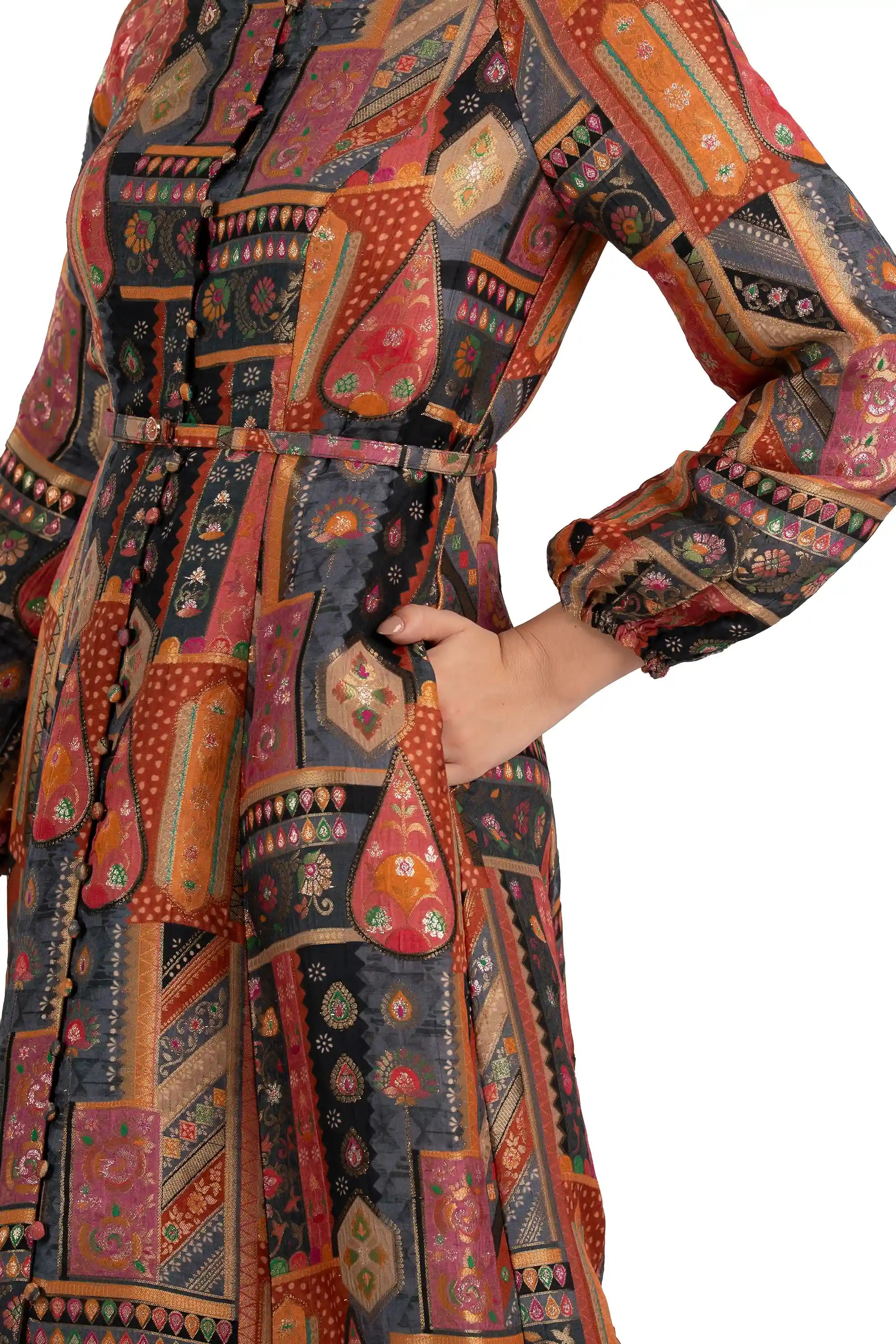 Close-up of belt, buttons and pocket on charcoal patchwork midi dress