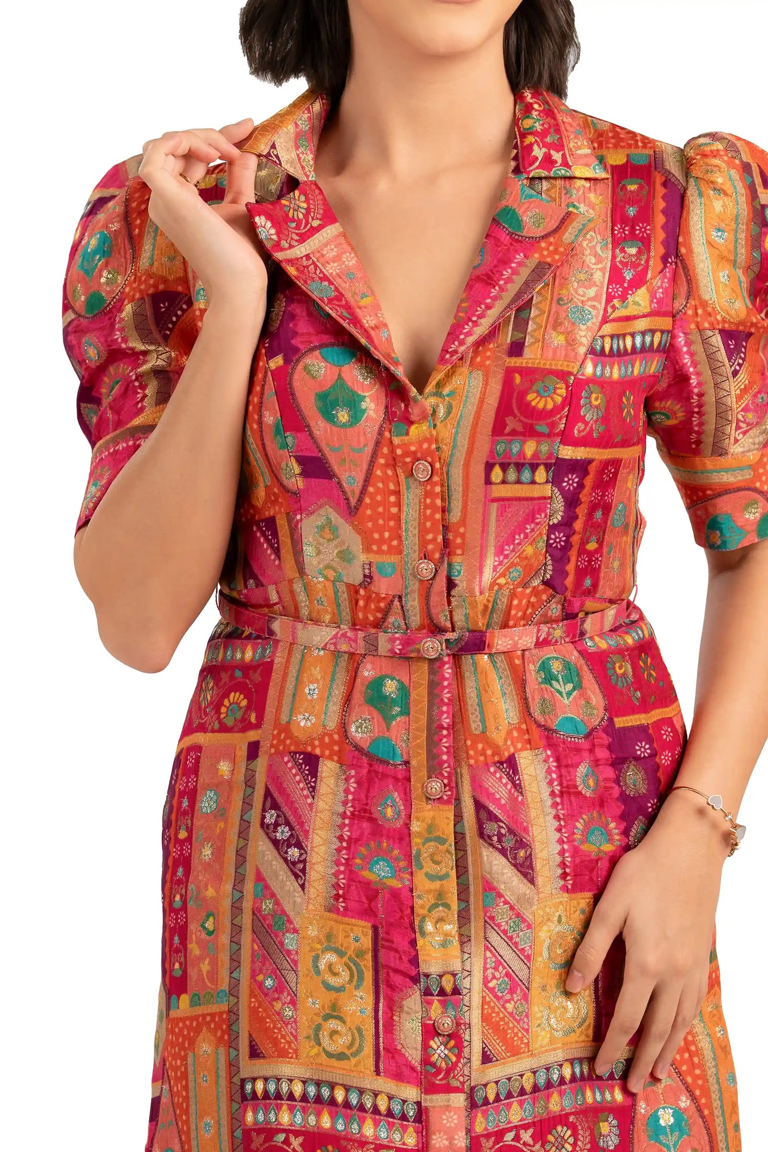 Close-up of notched collar and buttons on fuchsia patchwork midi dress