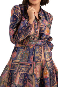 Close-up of belt and button placket on navy boho patchwork shimmer fabric dress