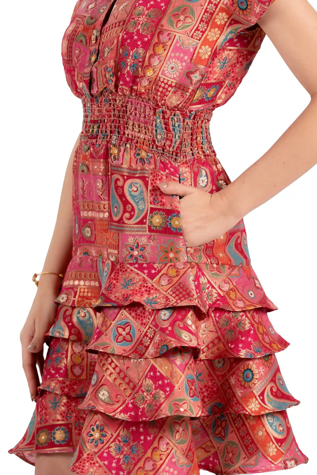 Close-up of pocket and ruffle tiered skirt on red boho patchwork dress