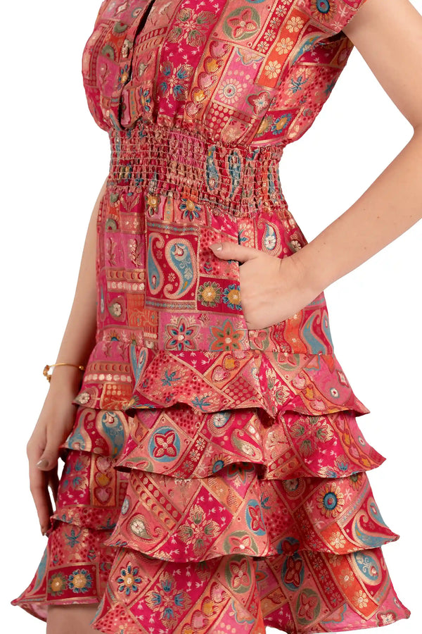 Close-up of pocket and ruffle tiered skirt on red boho patchwork dress