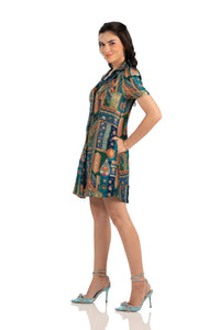 Side view of teal patchwork mini shirt dress with handy pockets