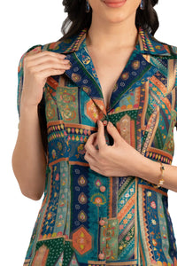 Close-up of notched collar and buttons on teal patchwork shirt dress