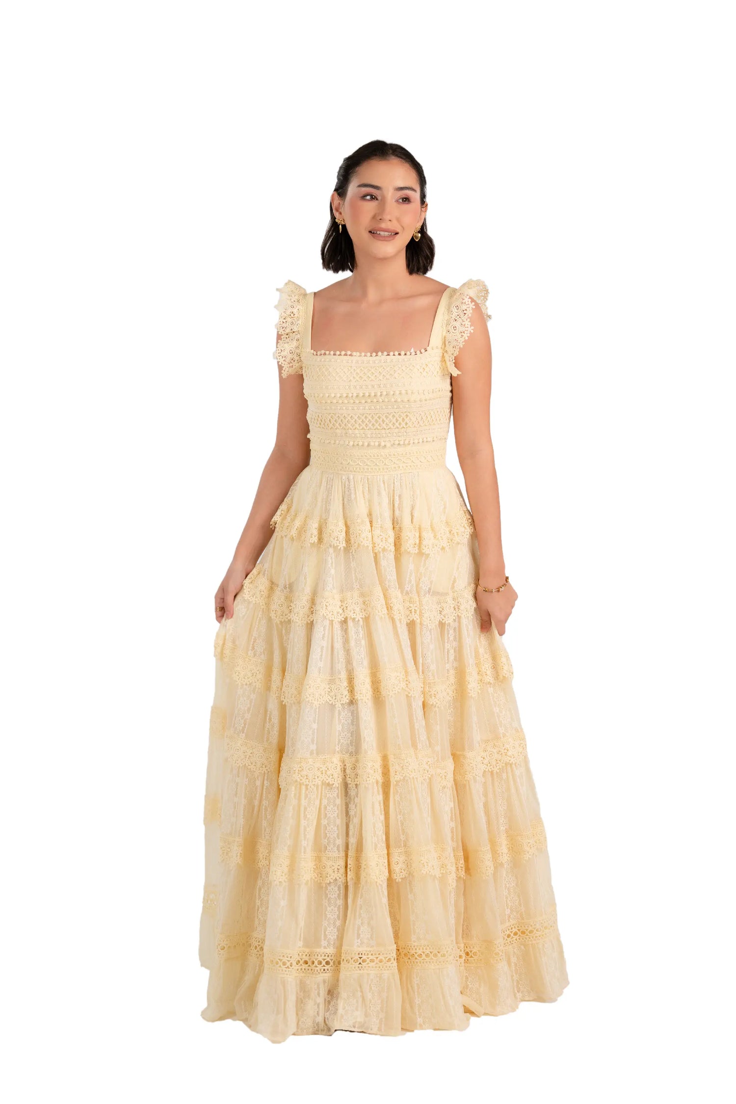 Front view of buttercream lace tiered maxi dress with square neckline and ruffle straps.