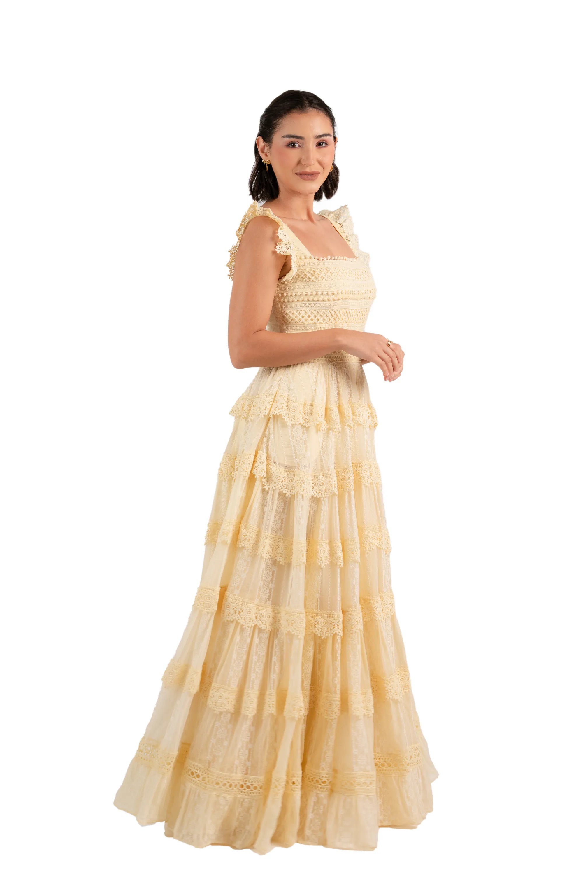 Side profile of buttercream lace tiered maxi dress with layered lace skirt.