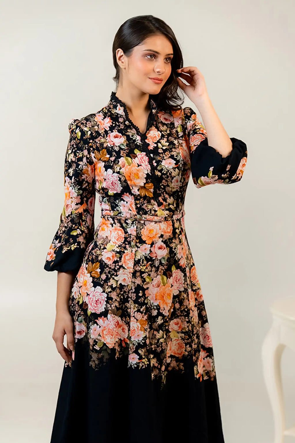 Side profile of black floral midi dress with vintage floral print
