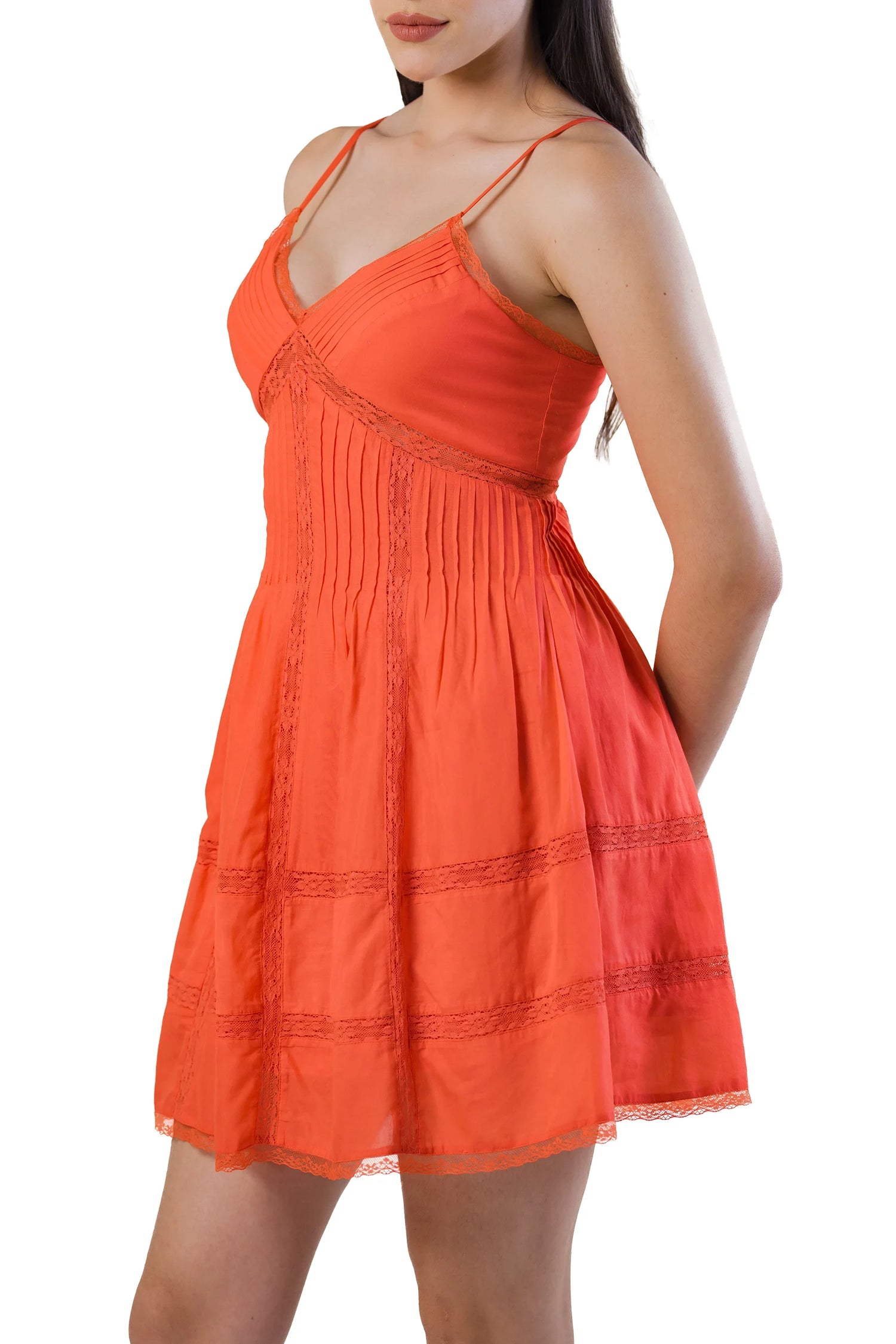 Side view of coral spaghetti-strap lace mini dress