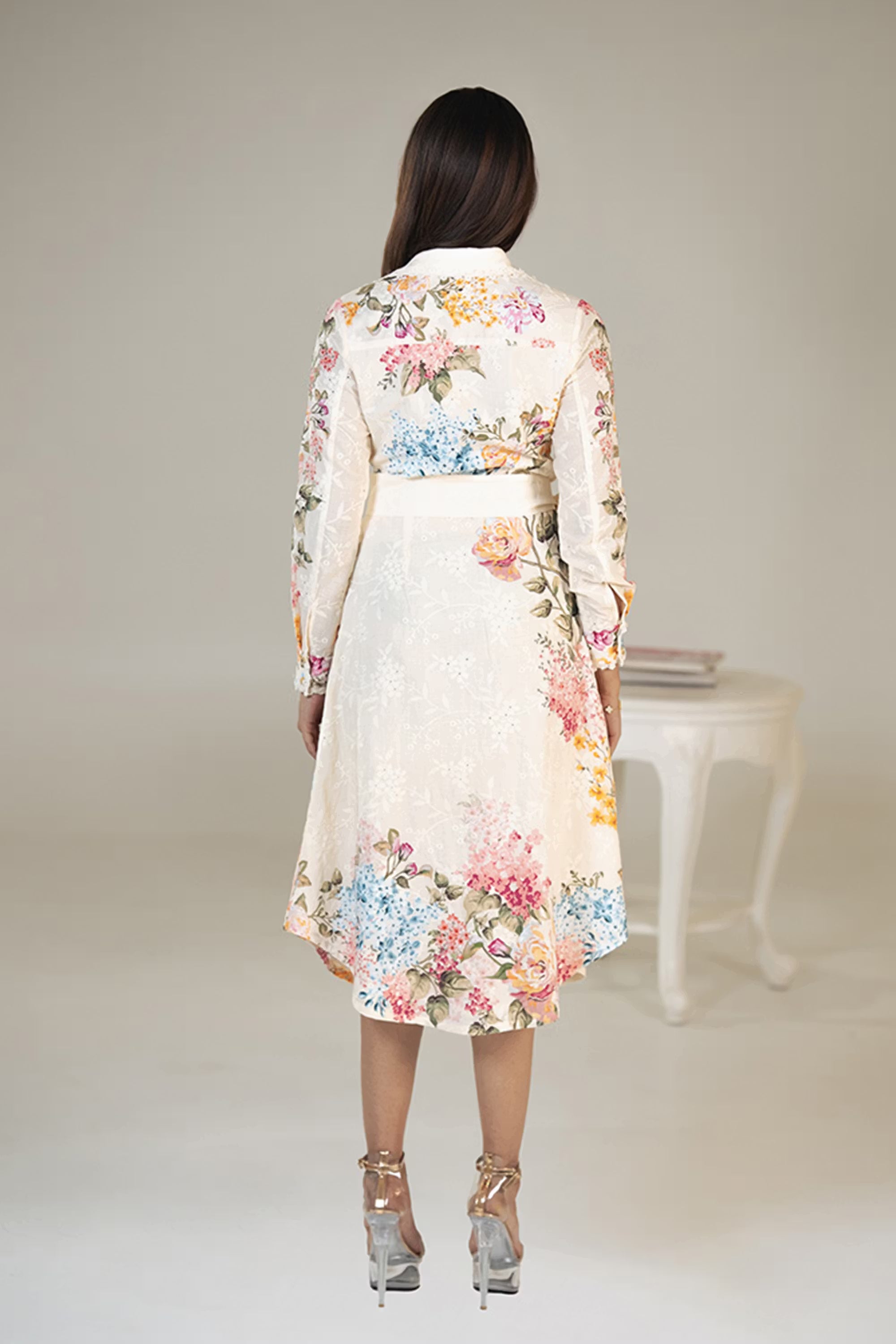 Back view of cream floral belted shirt dress with colorful floral patterns