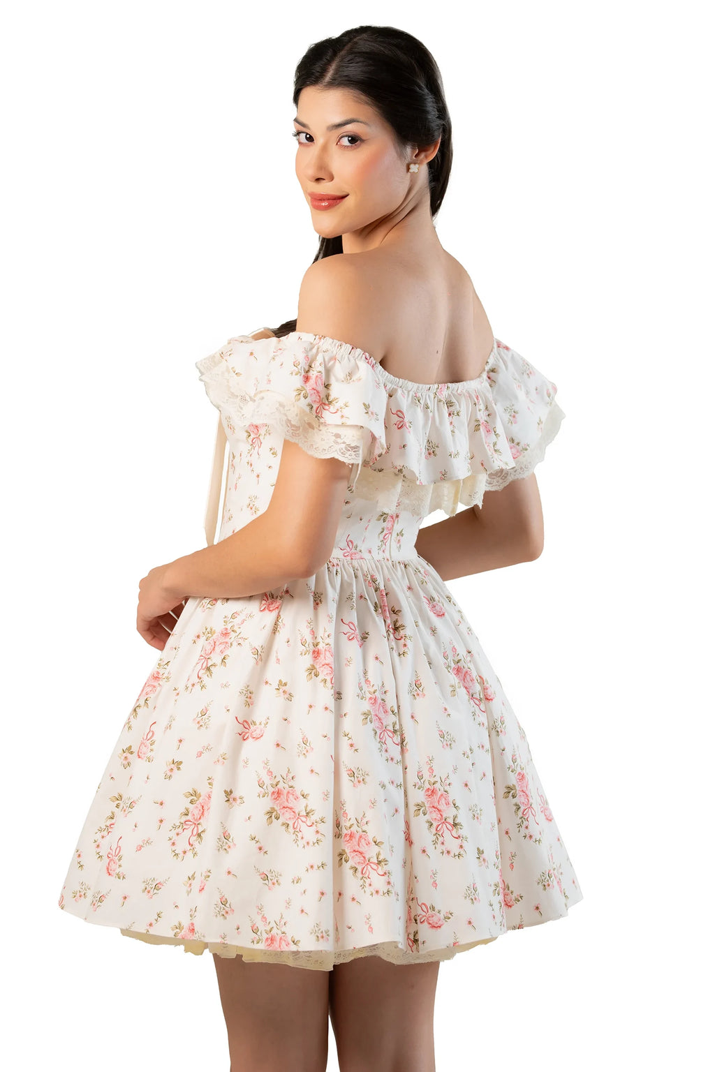 Back view of cream off-shoulder mini dress with ruffle overlay and flared skirt.