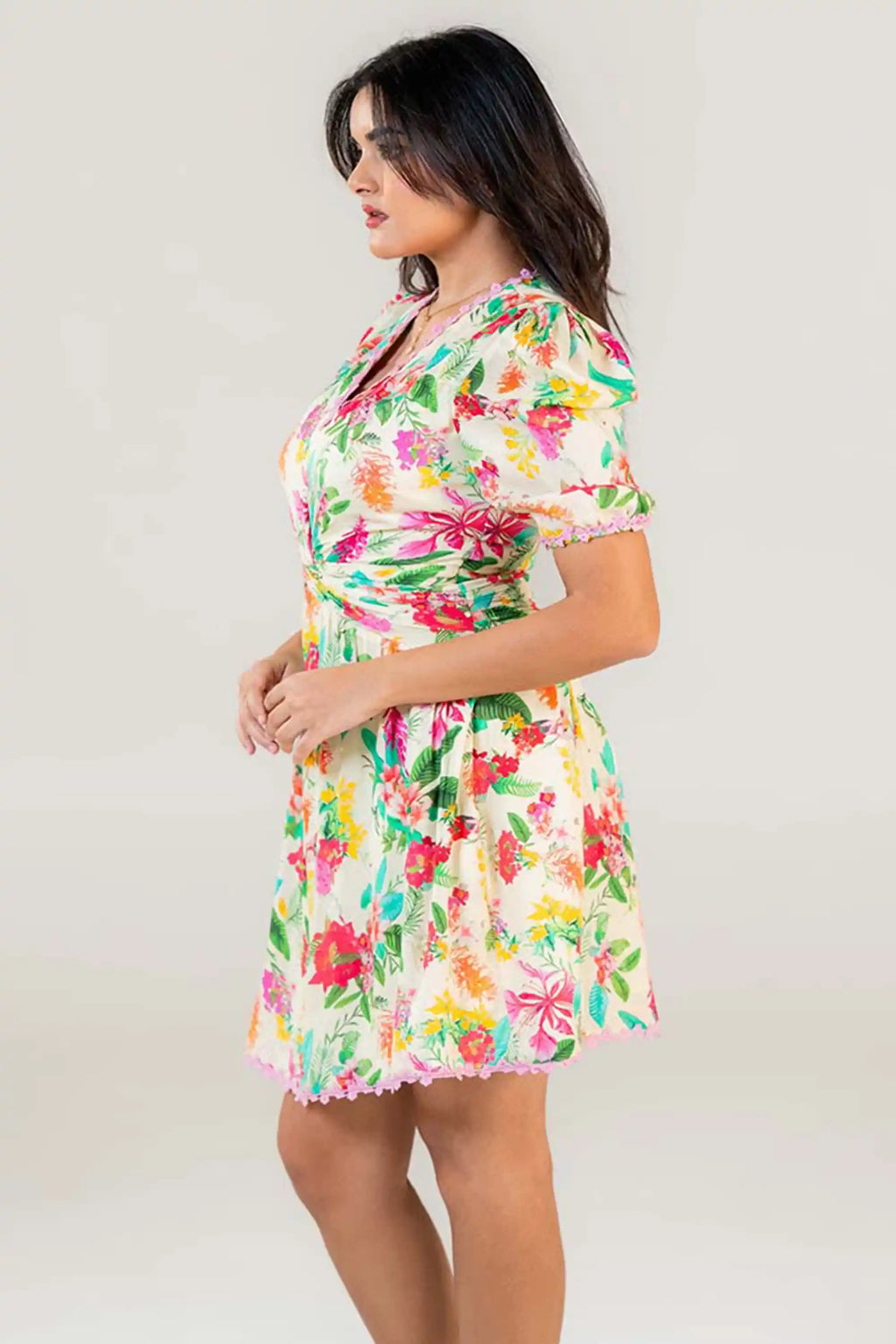 Side profile of cream puff sleeve short dress with floral print