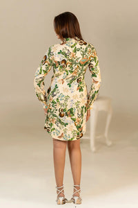 Back view of cream floral shirt dress with long sleeves.