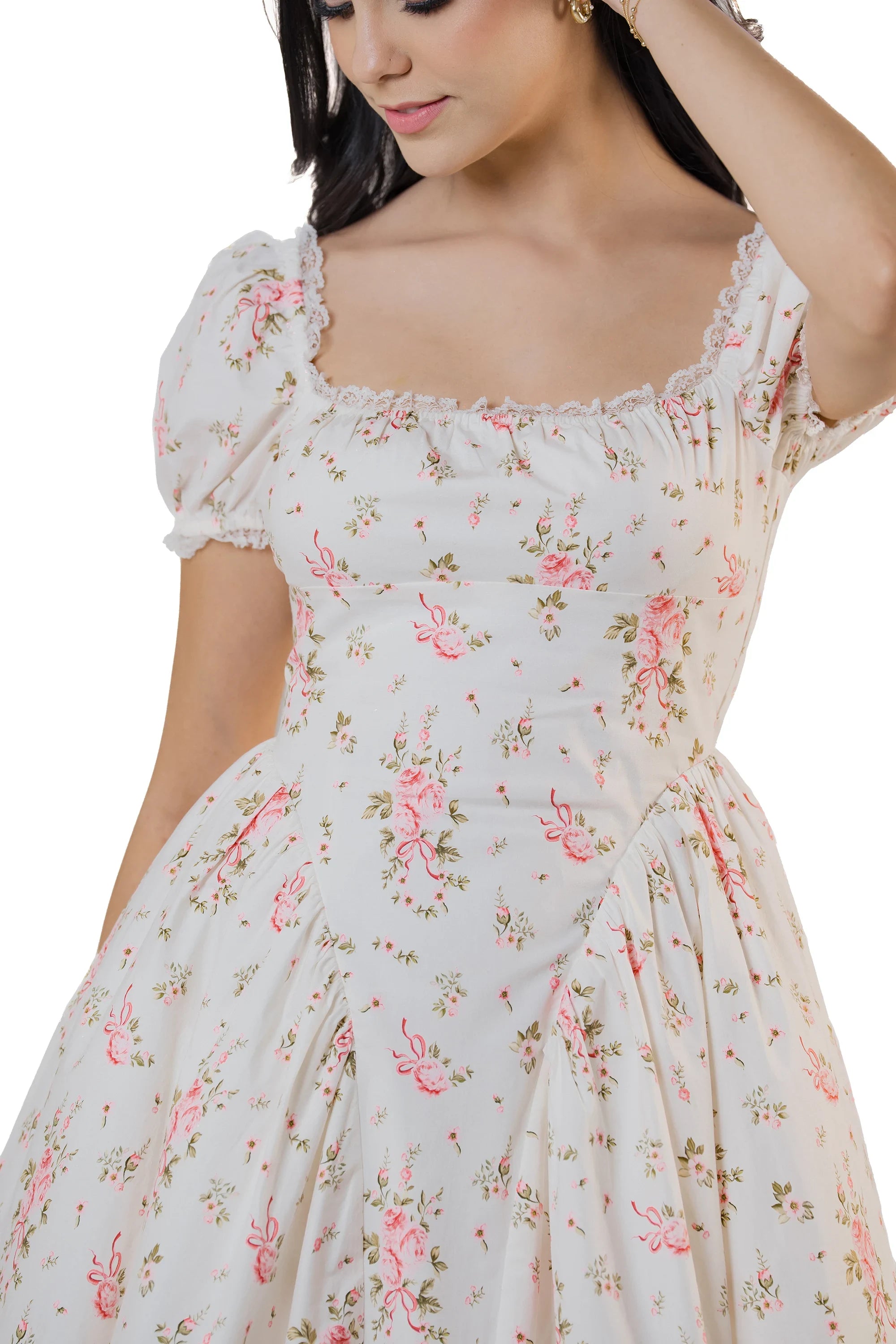 Close-up of cream white floral mini dress showing square neckline, puff sleeves, and fitted bodice.
