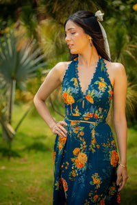 Dark teal floral halter neck maxi dress side profile with orange flower print