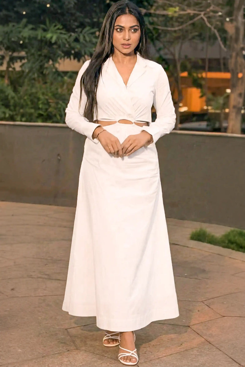 Delna wearing white long sleeve cut out maxi dress outdoors pretty pixie