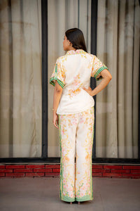 Back view of floral green border co-ord set with wide pants