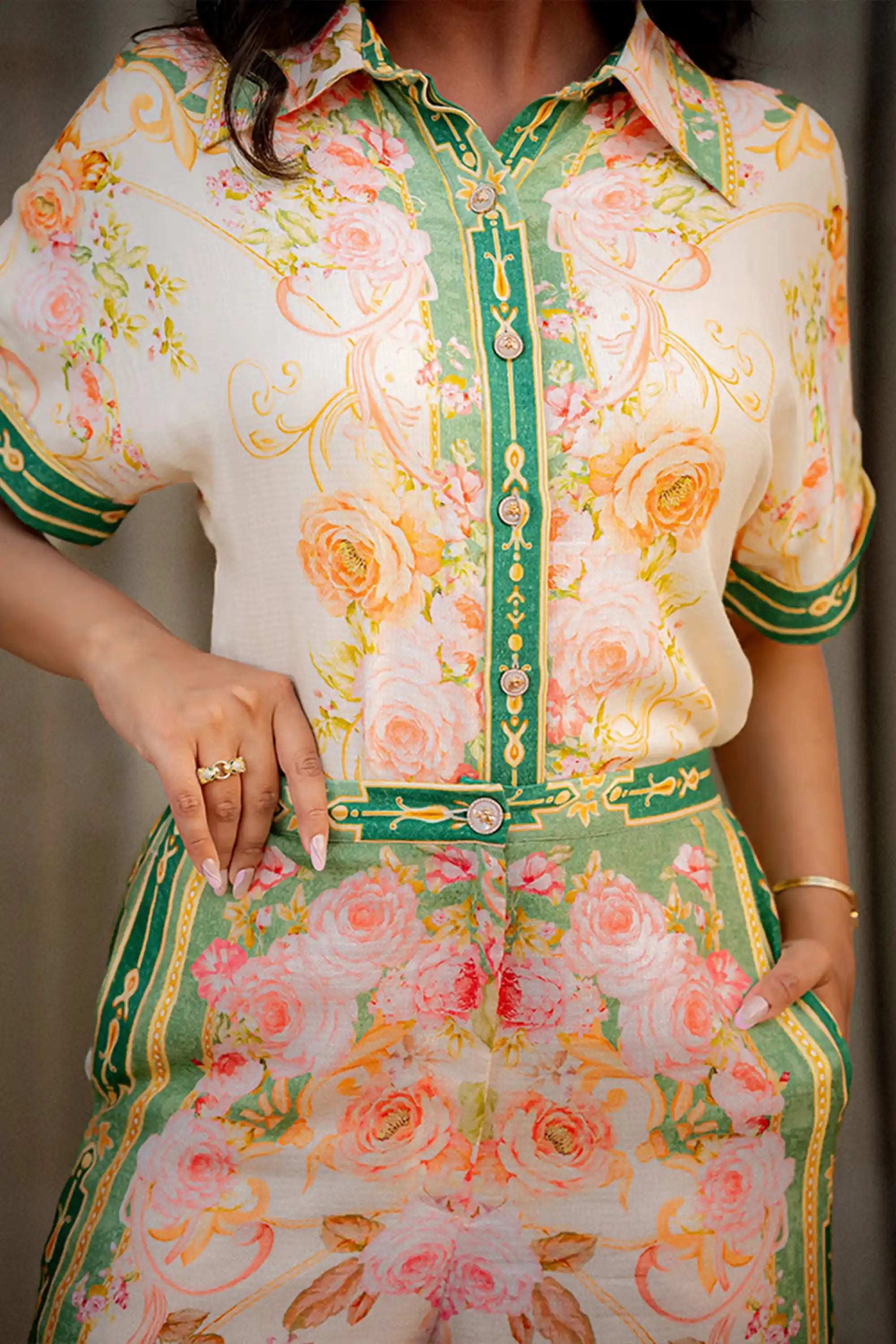 Front closeup of floral green border co-ord set with belt detail